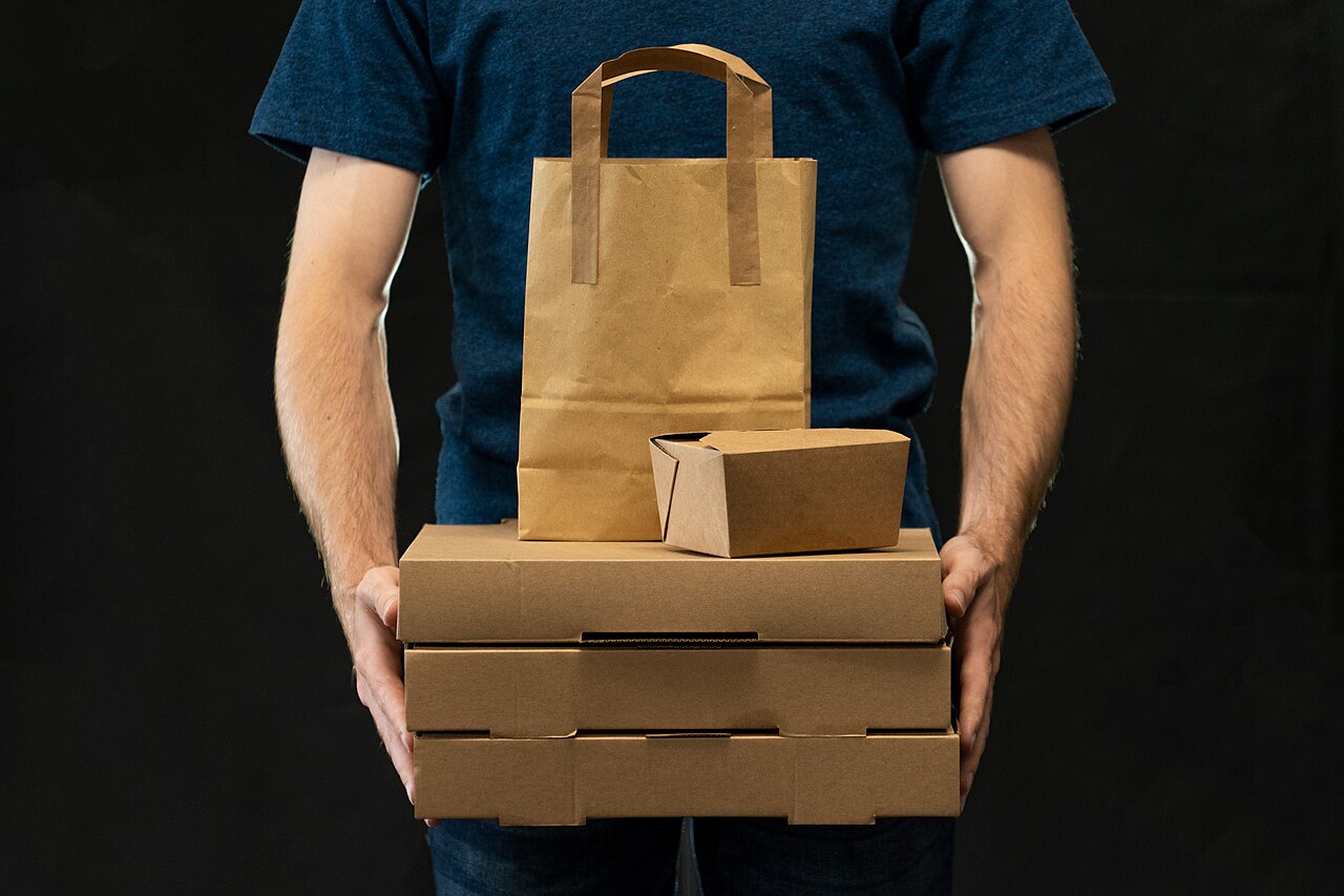 Food delivery courier A courier carrying takeaway delivery packages