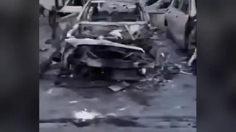 Burnt luxury car after fire at Moses Benz car lot Burnt-out shell of a luxury car after a fire at a car dealer's lot
